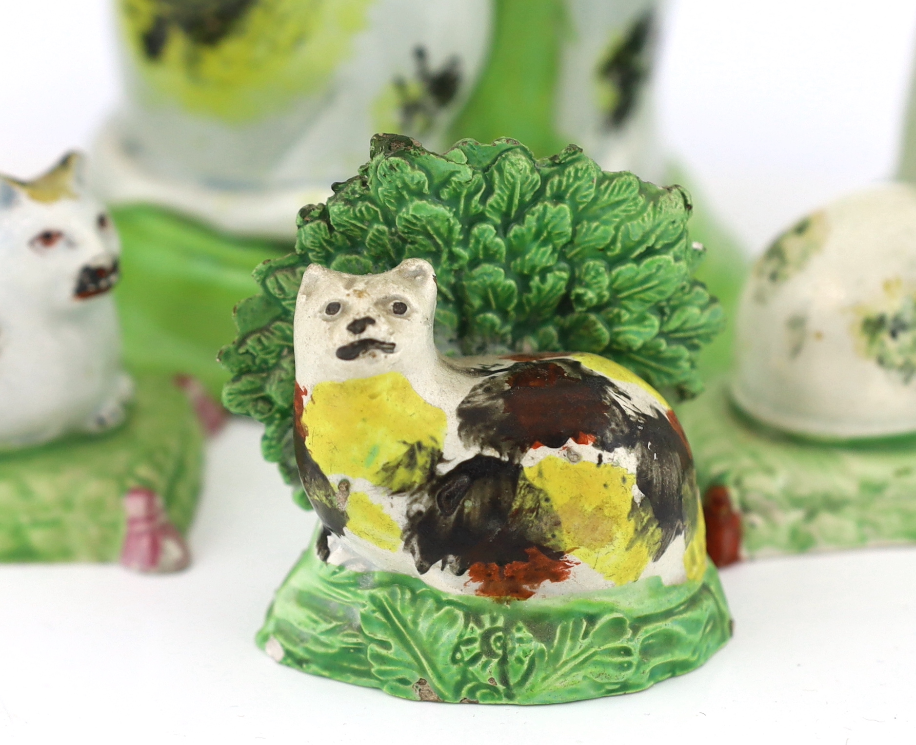 Six Staffordshire pearlware models of cats, early 19th century